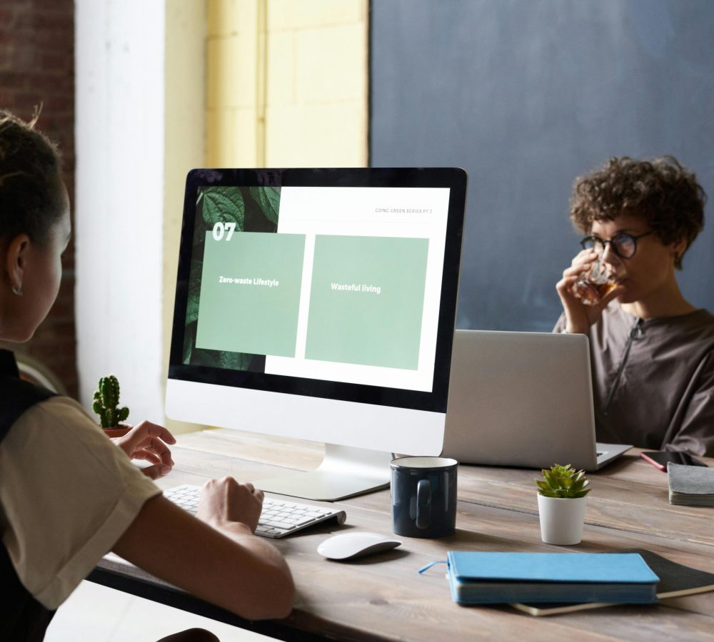 Colleagues discussing ideas and strategies during a team meeting in a modern office setting.